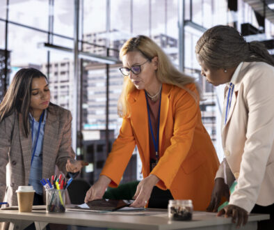 Women leaders strategizing in a corporate office focused on growth