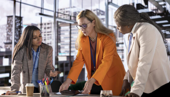 Women leaders strategizing in a corporate office focused on growth