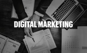 What is digital marketing? Professional workspace displaying marketing analytics, business reports, and a laptop.